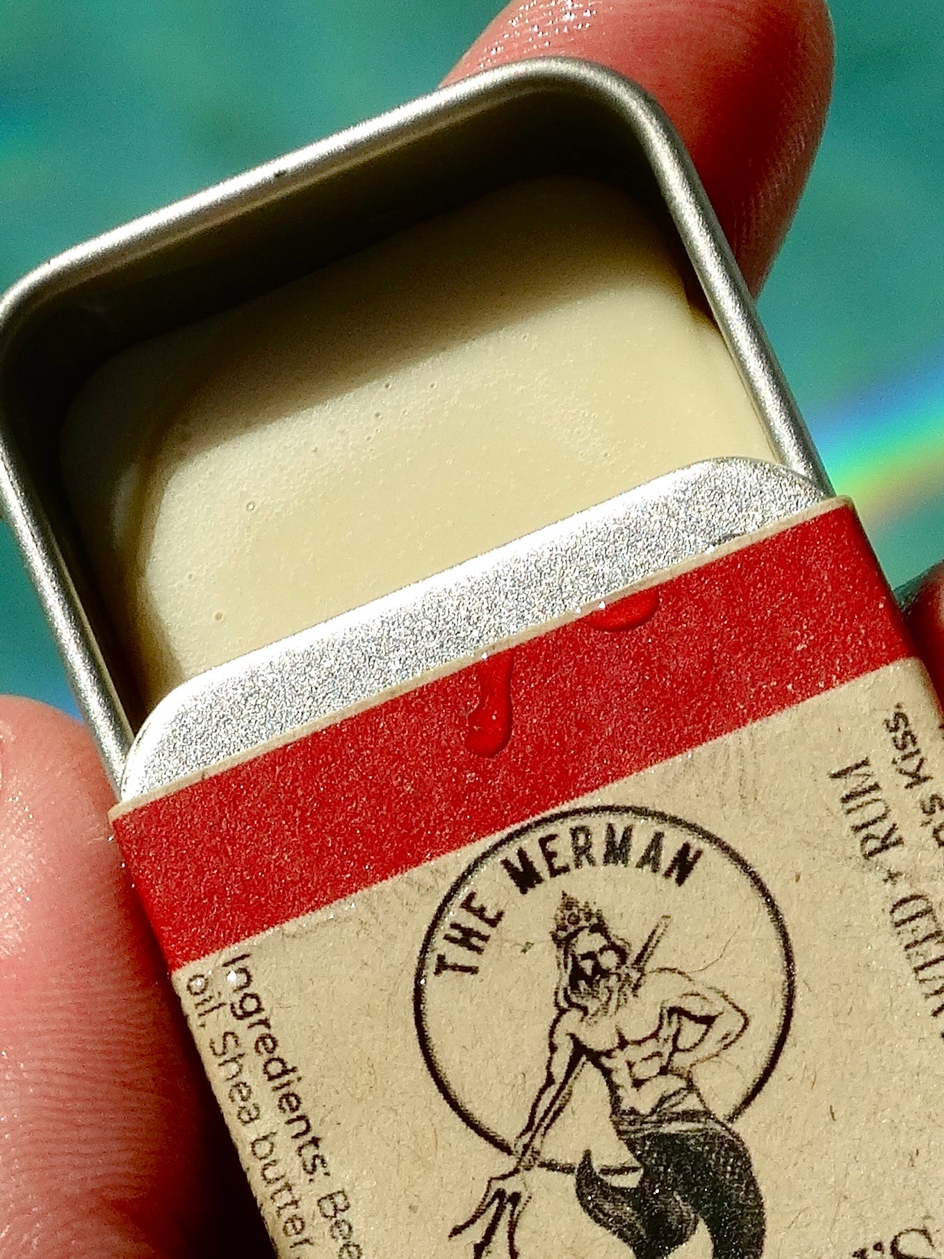 Lata de bálsamo labial de Merman